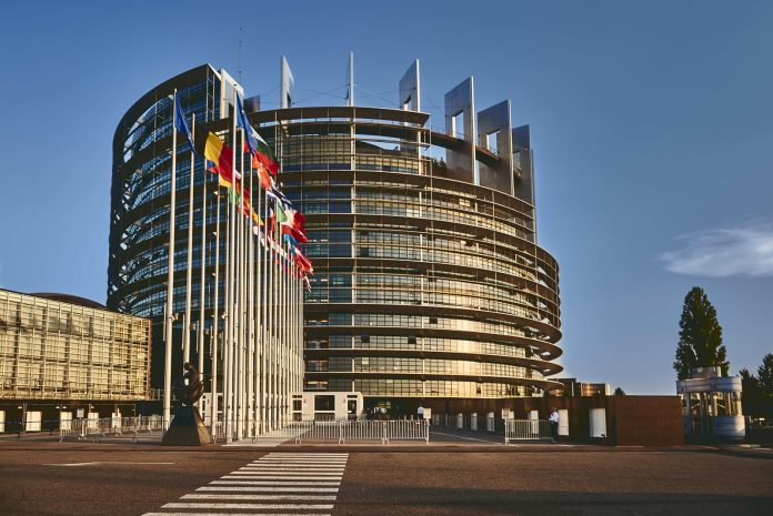 European Parliament building in Strasbourg, France with a clear blue sky in the background