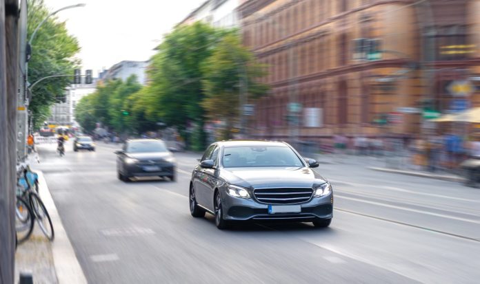 modern-sedan-city-street-car-motion-urban-traffic-flow